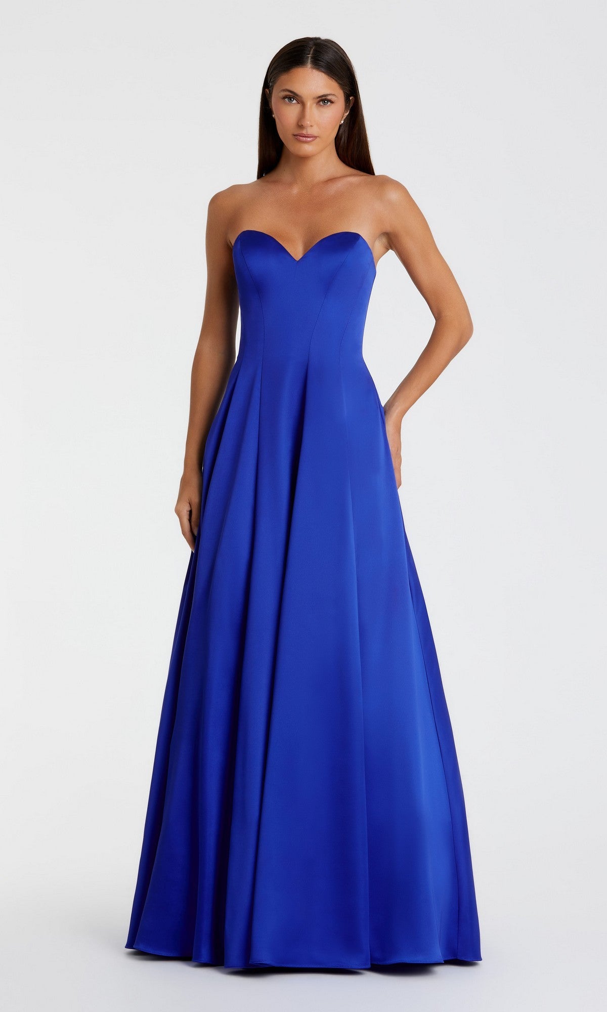 A woman models the Mac Duggal 68857 Long Formal Dress, a royal blue strapless satin gown with fitted bodice and flared skirt, set against a plain white background.